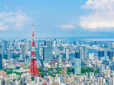 a view of a large city with a red tower at APA Hotel Shinagawa Sengakuji Ekimae in Tokyo