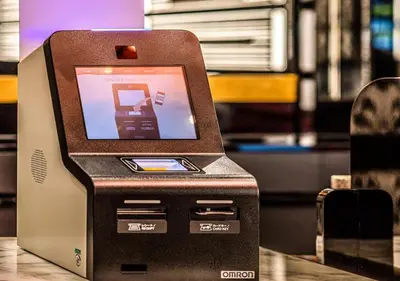an atm machine sitting on top of a table at APA Hotel Shinagawa Sengakuji Ekimae in Tokyo