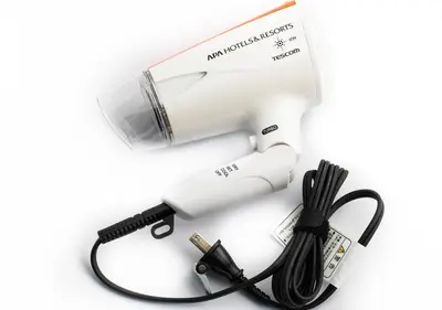 a hair dryer with a cord and a blow dryerimeter at APA Hotel Shinagawa Sengakuji Ekimae in Tokyo