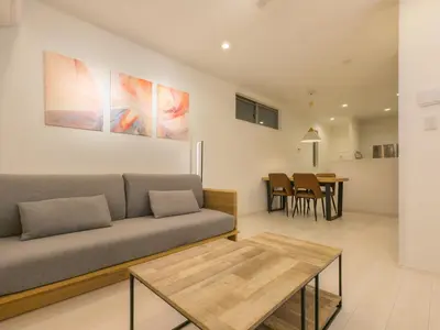 a living room with a couch and a table at japan house sumida House I Cozy&stylish in Tokyo