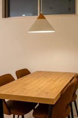 a dining room table with chairs and a light fixture at japan house sumida House I Cozy&stylish in Tokyo