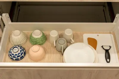 a drawer with a bunch of ceramics in it at japan house sumida House I Cozy&stylish in Tokyo