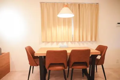 a dining room table with chairs and a light at japan House\u30b9\u30ab\u30a4\u30c4\u30ea\u30fc\u99c5\u5f92\u6b695\u5206\u30f4\u30a3\u30e9\u8cb8\u5207 2\u53f7\u9928 in Tokyo