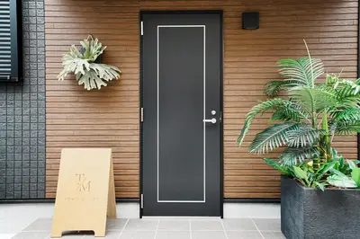 a black door with a sign in front of it at Tomo House Yotsuya-Sanchome 301 - from 6 minutes station \u56db\u8c37\u4e09\u4e01\u76ee 301 \u99c5\u304b\u3089\u5f92\u6b696\u5206 in Tokyo