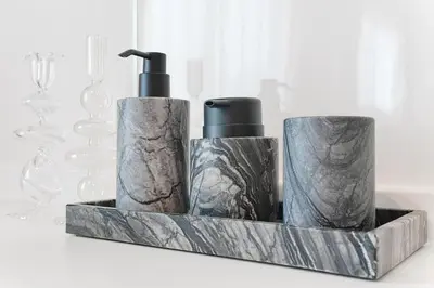 a group of three bottles in a wooden holder at Tomo House Yotsuya-Sanchome 301 - from 6 minutes station \u56db\u8c37\u4e09\u4e01\u76ee 301 \u99c5\u304b\u3089\u5f92\u6b696\u5206 in Tokyo
