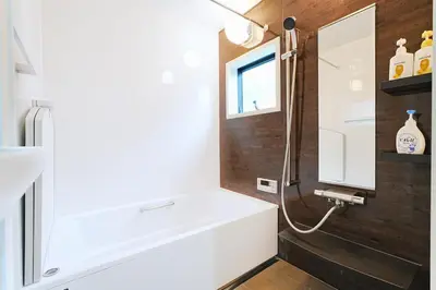 a bathroom with a white sink and a mirror at Tomo House Otsuka - from 6 minutes station \u5927\u585a \u99c5\u304b\u3089\u5f92\u6b696\u5206 in Tokyo