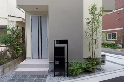 a building with a black elevator in front of it at \u4e09\u7530\u7dda\u897f\u5de3\u9d28\u99c5\u5f92\u6b692\u5206 \u6238\u5efa\u3066 4LDK \u6c60\u888b13\u5206 2 min to Nishisugamo station 30 min to Shibuya 4LDK in Tokyo