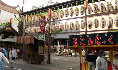 a building with chinese signs on the side of it at \u4e09\u7530\u7dda\u897f\u5de3\u9d28\u99c5\u5f92\u6b692\u5206 \u6238\u5efa\u3066 4LDK \u6c60\u888b13\u5206 2 min to Nishisugamo station 30 min to Shibuya 4LDK in Tokyo