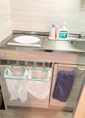 a small bathroom with a sink and a counter at Tomo House \u897f\u65b0\u5bbf\u4e94\u4e01\u76ee\u30a2\u30d1\u30fc\u30c8 301 in Tokyo