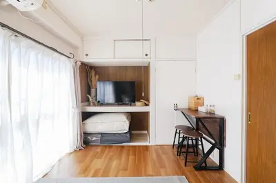 a bedroom with a bed and a desk and a television at Tomo House Yoyogi 301 - from 4 minutes station \u4ee3\u3005\u6728 301 \u99c5\u304b\u3089\u5f92\u6b694\u5206 in Tokyo