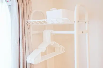 a white shelf in a room with a curtain at Tomo House Yoyogi 301 - from 4 minutes station \u4ee3\u3005\u6728 301 \u99c5\u304b\u3089\u5f92\u6b694\u5206 in Tokyo