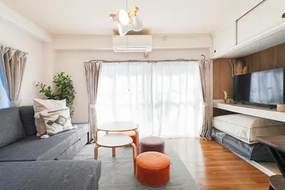 a small living room with a couch and a bed at Tomo House Yoyogi 301 - from 4 minutes station \u4ee3\u3005\u6728 301 \u99c5\u304b\u3089\u5f92\u6b694\u5206 in Tokyo