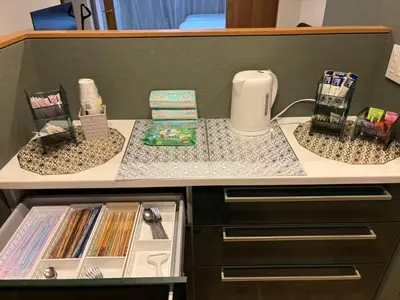 a kitchen with a counter top with an open refrigerator at \u9759\u8c27\u65f6\u5149 1f in Tokyo