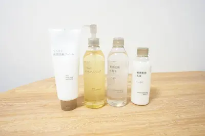 a group of three bottles sitting on a wooden table at Aki Hiroo Stay 101 in Tokyo
