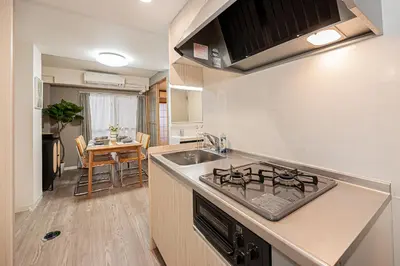 a kitchen with a sink and a stove top oven at Ikebukuro Stay,Higashiikebukuro walk 4 min equipped with an elevator in Tokyo