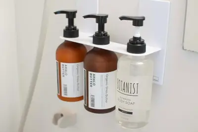 three bottles of essential oils in a refrigerator at Aki Shin-Okubo Stay 105 in Tokyo