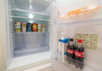 an open refrigerator filled with drinks and food at lkebukuro-Five palace in Tokyo