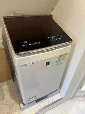 a stove top oven sitting on top of a refrigerator at lkebukuro-Five palace in Tokyo