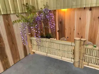 a room with a fence with purple flowers in a vase at lkebukuro-Five palace in Tokyo