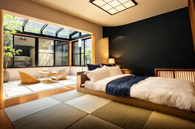 a bedroom with a bed and a large window at share's TOKYO Japandi Design Apartment Near Shinjuku in Tokyo