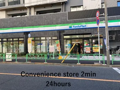 a convenience store with a yellow pole in the street at share's TOKYO Japandi Design Apartment Near Shinjuku in Tokyo