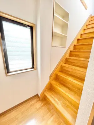 a staircase in a house with a window at Shinkoiwa Matsushima HOUSE in Tokyo