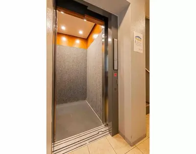 a glass door leading to a elevator in a building at Akihabara Skytree Premium Apartment 201 in Tokyo