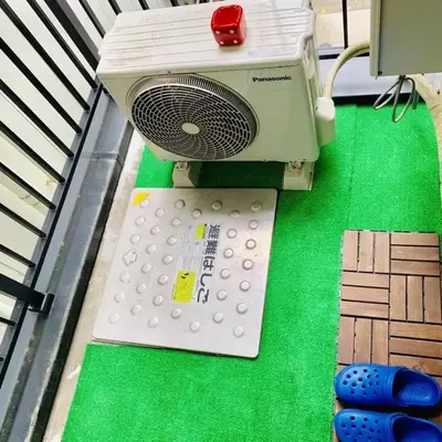 a toy computer sitting on top of a green table at Akihabara Skytree Premium Apartment 301 in Tokyo