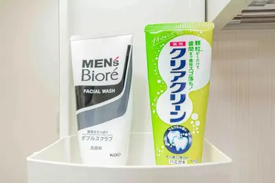a shelf with a toothbrush and a tube of toothpaste at Akihabara Skytree Premium Apartment 301 in Tokyo