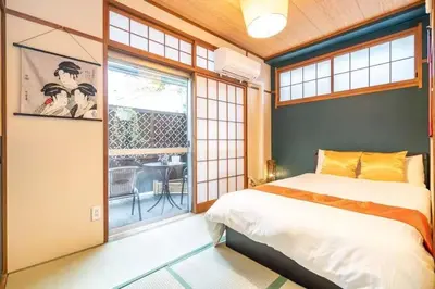 a bedroom with a bed and a large window at Ikebukuro and Yunxuan in Tokyo