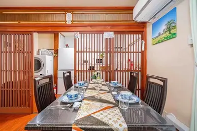 a dining room with a long table and chairs at Ikebukuro and Yunxuan in Tokyo