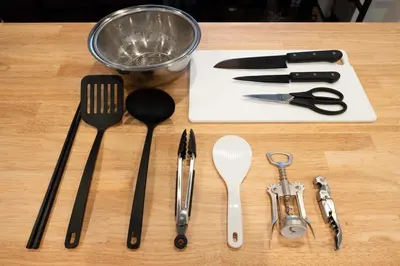 a wooden table with utensils on a cutting board at \u672a\u516c\u958bB107 sumicco in Tokyo