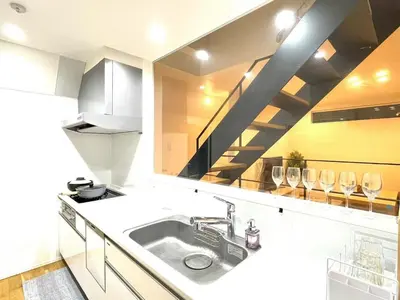 a kitchen with a sink and a staircase at Detached Villa 4LDK Free Parking, 4 min walk to Sengawa Station, Toshima Ward in Tokyo