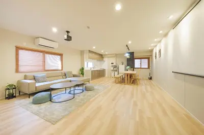 a living room with a couch and a table at Breeze Stay Shiohama in Tokyo