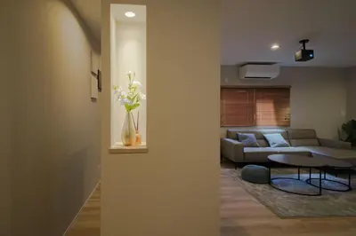 a living room with a couch and a table at Breeze Stay Shiohama in Tokyo