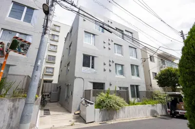 an apartment building on the corner of a street at PASEO\u5e02\u8c37\u53f0\u753all in Tokyo