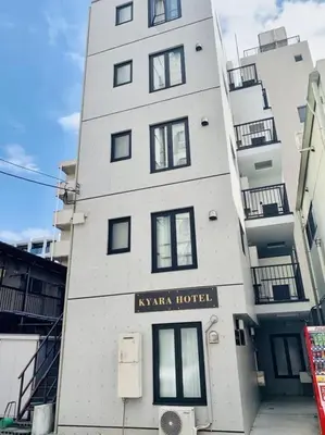 a tall white building with a hotel sign on it at Akihabara Skytree Premium Apartment 302 in Tokyo