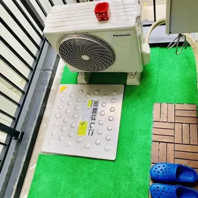 a machine sitting on top of a green table at Akihabara Skytree Premium Apartment 302 in Tokyo