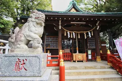 a statue of a lion in front of a building at Hotel Little Stay Tateishi 1F in Tokyo