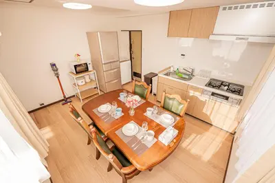 a kitchen and dining room with a table and chairs at Mori hotel \u5341\u6761401 in Tokyo