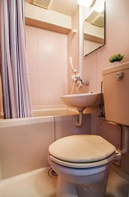 a bathroom with a toilet and a sink at CraftFlat Numabukuro 305, uphill residence monthly stay in Tokyo