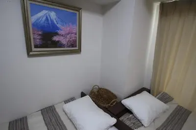 a room with a bed and a picture on the wall at arpeggioTERRACE 701 in Tokyo