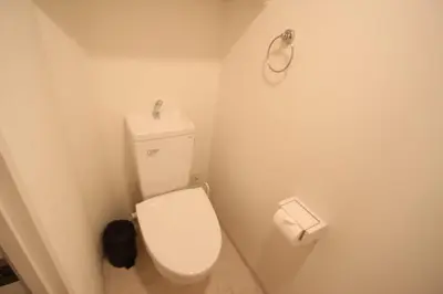 a bathroom with a white toilet and a trash can at arpeggioTERRACE 701 in Tokyo