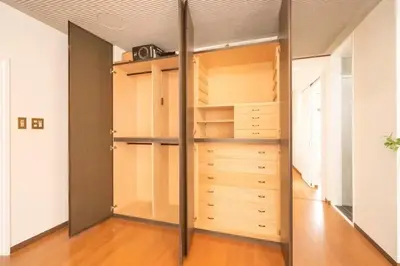 a closet with wooden shelves and a mirror at My Sumida Home A in Tokyo
