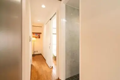 a room with a hallway with a glass wall at My Sumida Home A in Tokyo