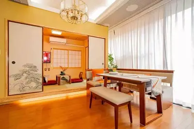 a living room with a table and a dining room at My Sumida Home A in Tokyo