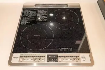 a laptop computer sitting on top of a table at My Sumida Home A in Tokyo