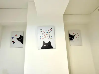 four pictures of black cats and hearts on a wall at Ikebukuro\u4e2d\u5ddd6H-TS0037 in Tokyo