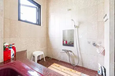 a bathroom with a shower and a sink at My Sumida Home B in Tokyo