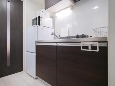 a kitchen with a sink and a refrigerator at m2\u30db\u30c6\u30eb in Tokyo